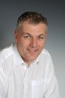 A set of photographs of David Walker, Operations Director for the company MicroEmissive Displays.  3 images taken in September 2007.
